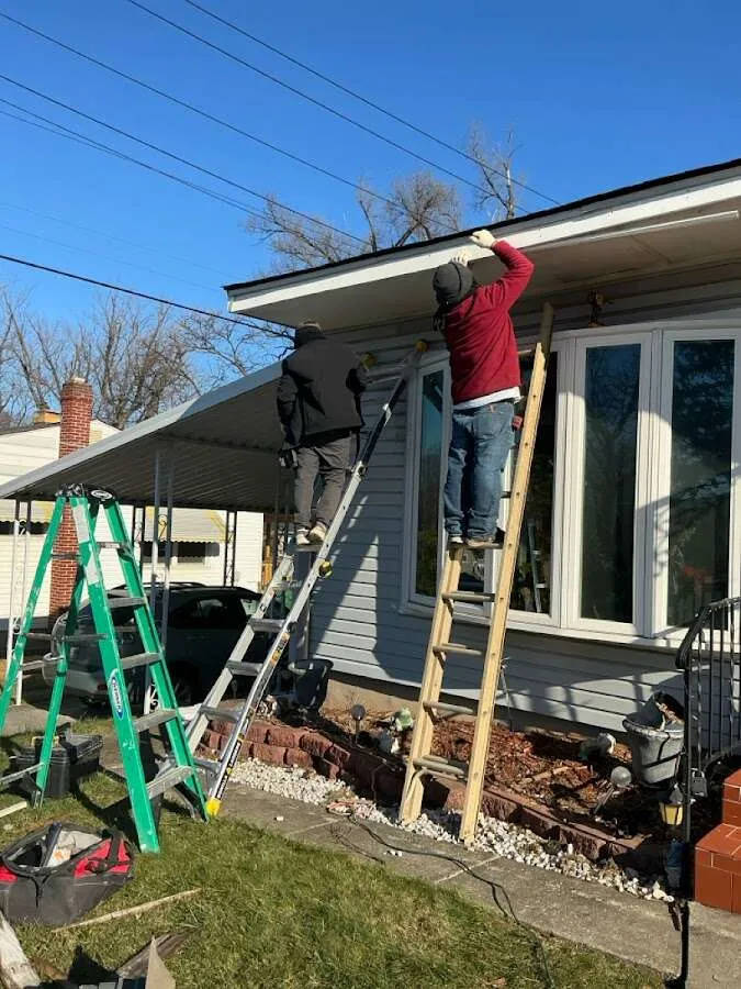 Restoration crew performing exterior repair in Maplewood
